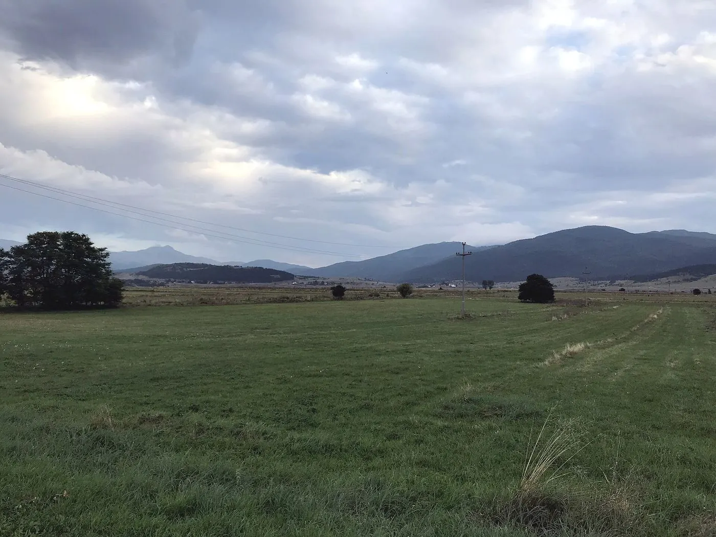 Meadows near Obljaj under clouds